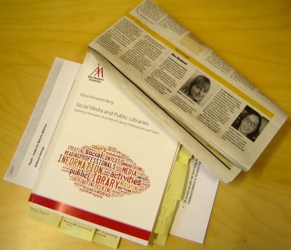 The opponent's marked-up copy of the thesis and coverage of the defence in the local press